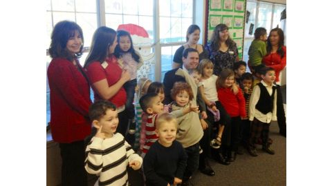 Scott with the staff and students at KinderCare Valencia