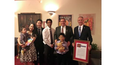 Timothy Zhang (baby) with parents Richard and Grace, Rodney Dong, PWCF Board of Directors, Senator Wilk, Kiran Dong and Roger Goatcher, PWCF Board of Directors President